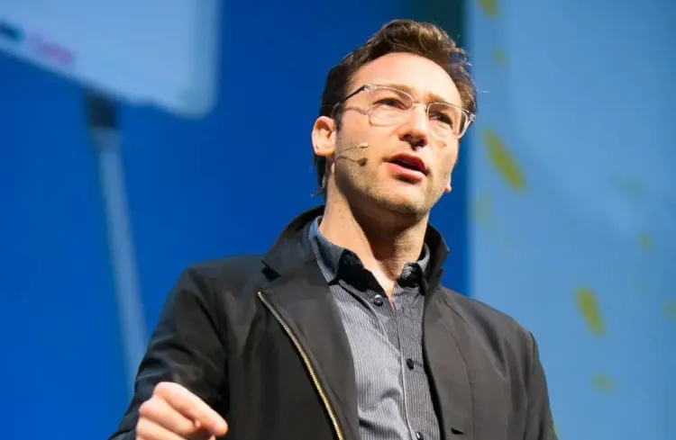 Simon Sinek speaking on stage